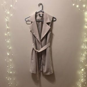 Sleeveless vest, mid thigh length